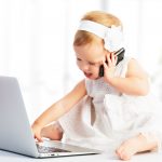 baby girl with computer laptop,  mobile phone